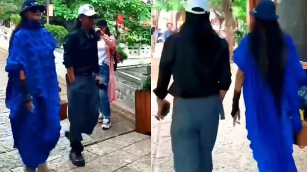 杨丽萍|63岁杨丽萍街头遭围观！脚踩厚底鞋打扮夸张，神秘异性全程陪伴