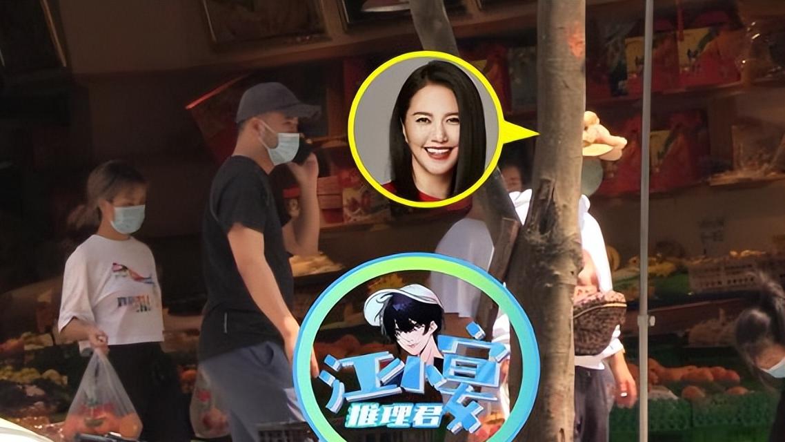 谭维维|谭维维抱两孩子出镜，疑似已经当妈，和老公外出给孩子挑水果