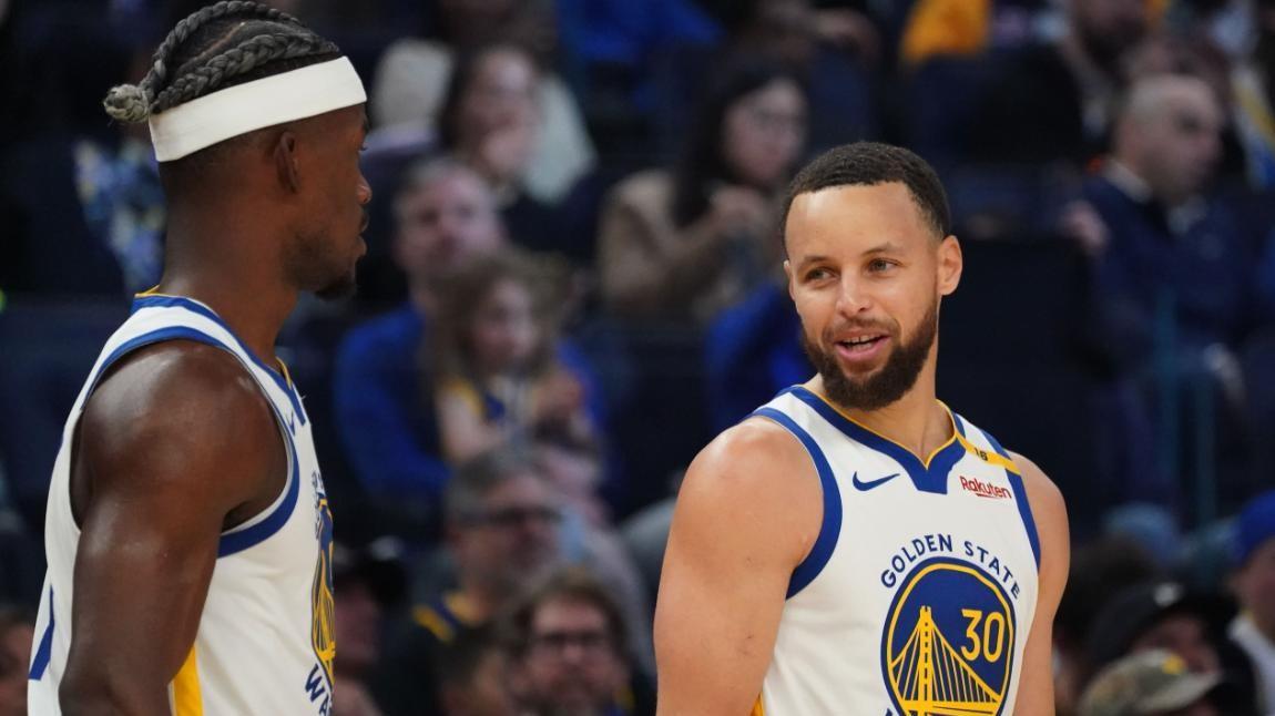 勇士险胜灰熊锁定第七，库里巴特勒合砍75分，达成NBA历史新纪录