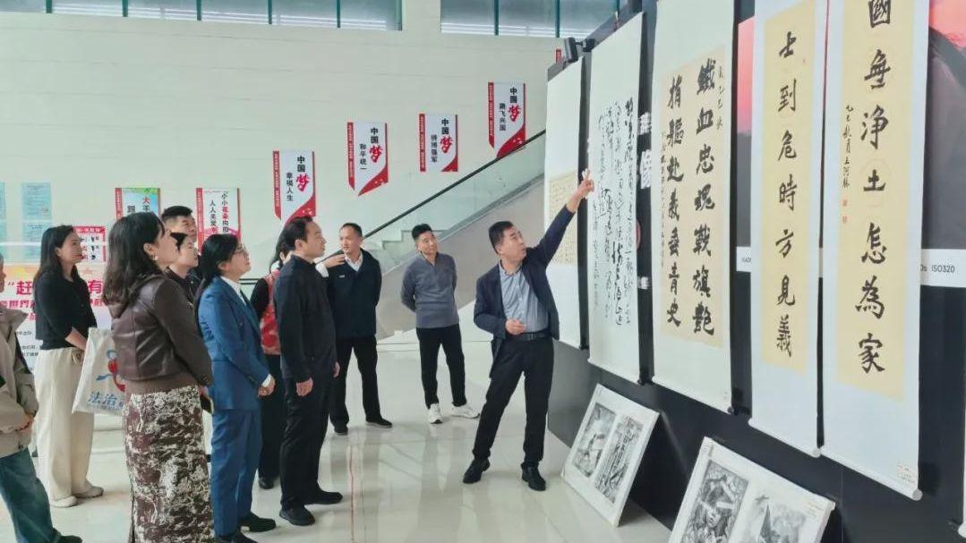 信阳市教体局：翰墨丹青铭历史 薪火相传启新程