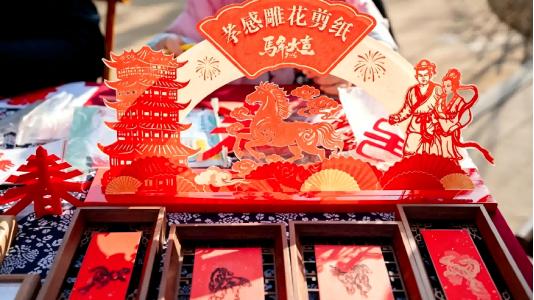 “非遗+终端服务”：他们将方寸红纸“剪”进街巷烟火里