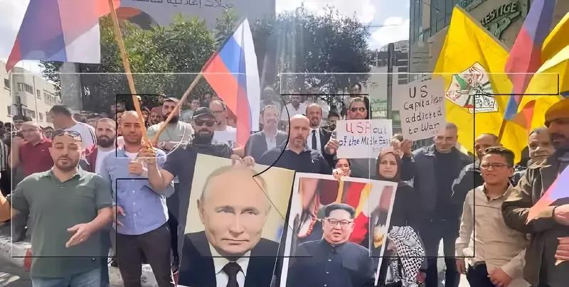 为什么巴勒斯坦人举着普京与金正恩的画像游行抗议以色列？普京和金正恩是巴勒斯坦人民