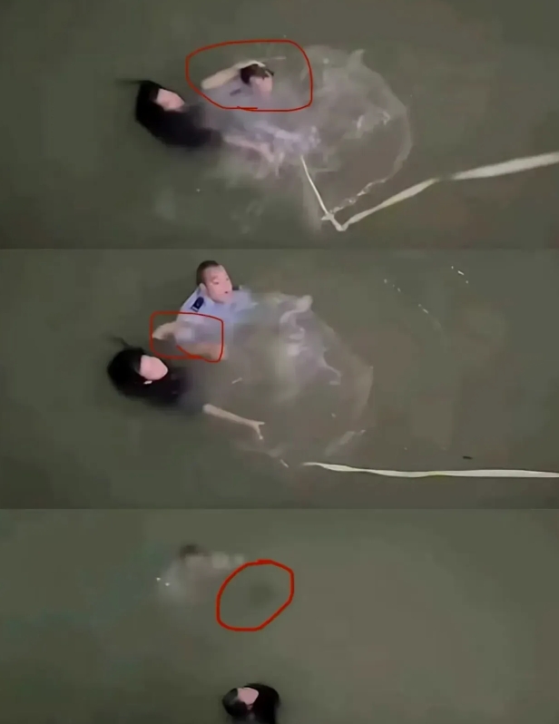 民警为了救这个女的，第二次下水，已经箭皮力尽了。当绳子扔下来是，民警想抓住绳子，