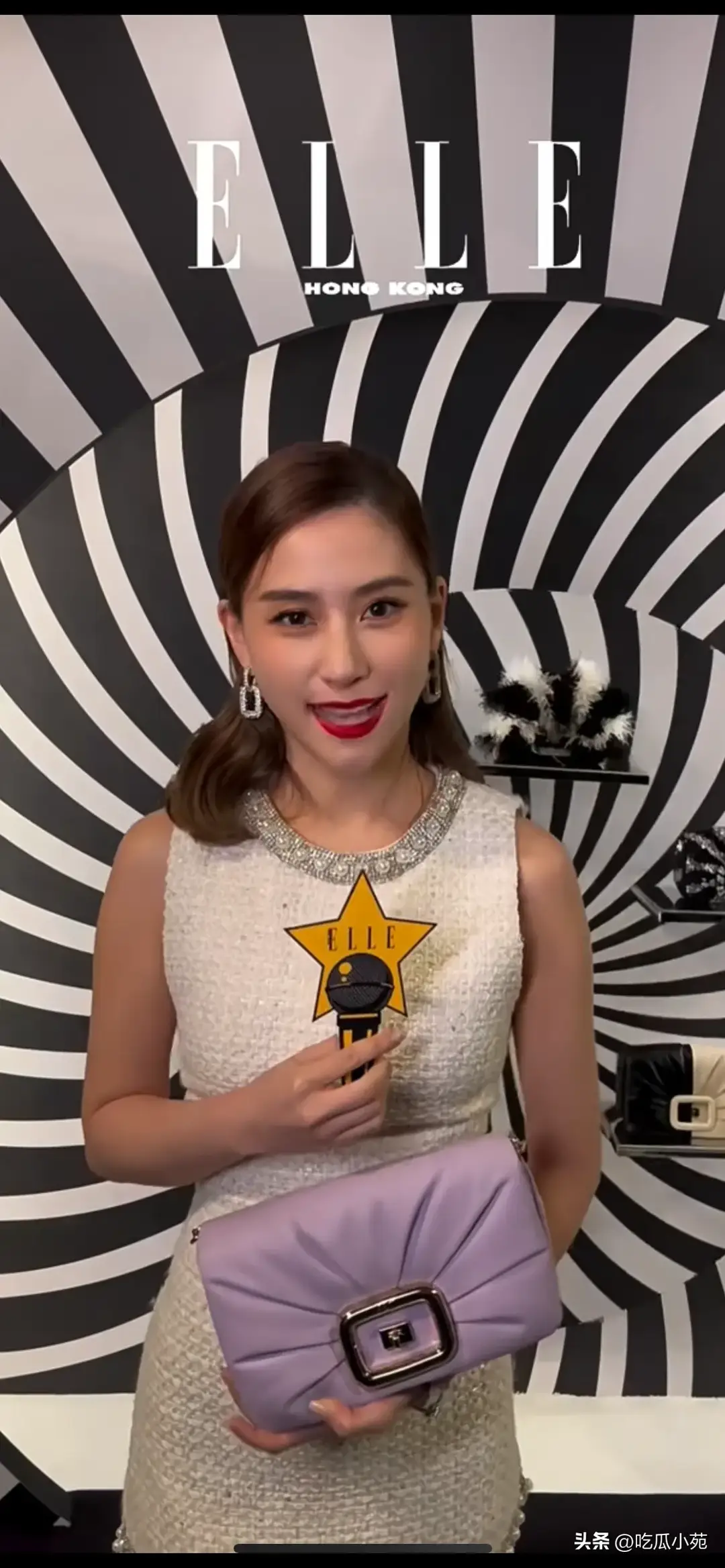 赌王千金何超莲采访生图，身材很好，面部不太自然，有医美痕迹。