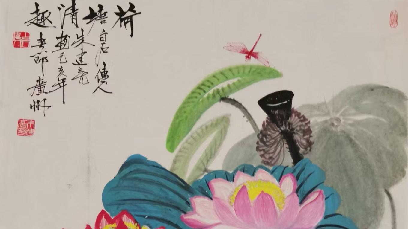 白石传人朱建亮把对祖国对新生活的赞美写在书中、作在画里