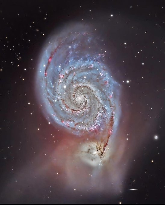 图为哈勃太空望远镜拍摄的涡状星系，又叫M51。这个星系位于距离我们大约2300万