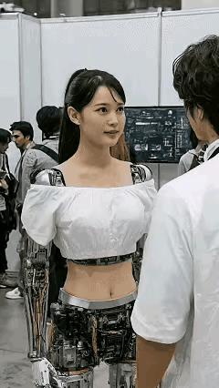 一位帅哥
去看机器人展会
帅哥被一位美女机器人迷住了
美女机器人冲他点头微笑
帅