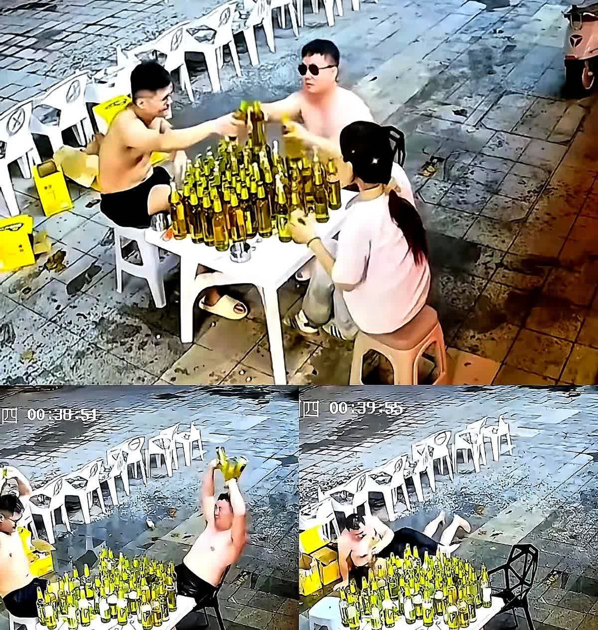 近日，在济南一家饭店的门口，两名光膀男子和一名女子，坐在一个桌前，桌上摆满了啤酒