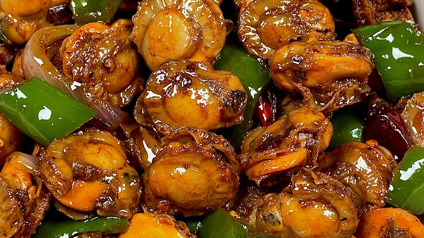 爆炒扇贝肉：海风里的鲜甜密码，一口吃出家的味道
