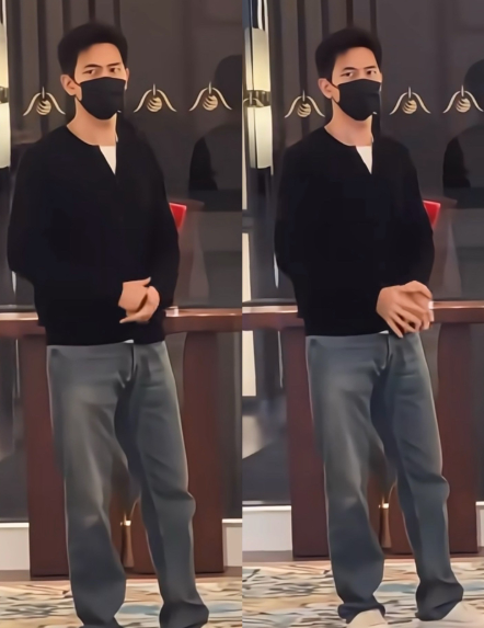 我猜李现有点冷，站在角落搓小手。李现在澳门，穿着黑色衣服和牛仔裤，走起路来好帅气