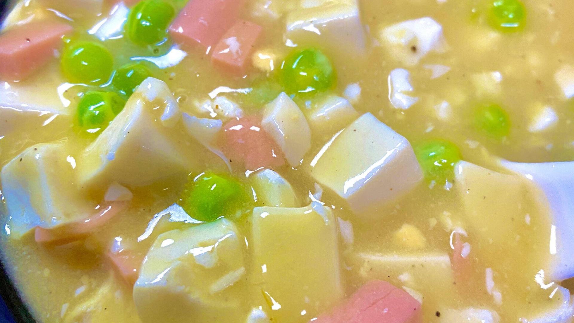 金沙铺底的月光：蟹黄豆腐的家宴魔术