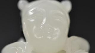 和田玉籽料|和田玉籽料童子戏狮把件