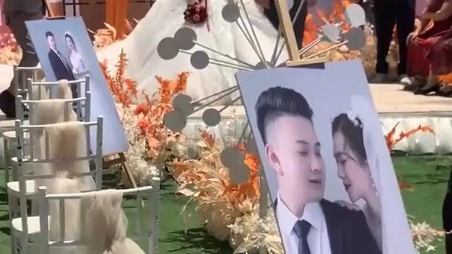 河南焦作天气过热，婚礼红蜡烛被晒化，婚庆人员用手扶都扶不起来