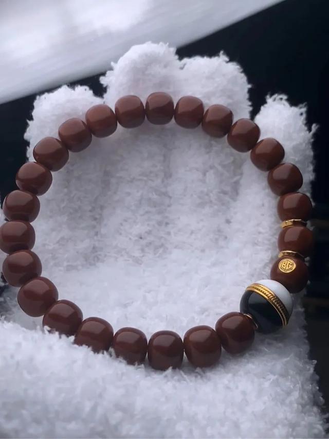 文玩为什么要戴手套盘串？