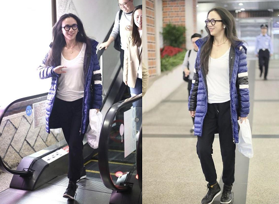 汤唯现身机场，一人独自拖拽3个行李箱，面对合影热情回应