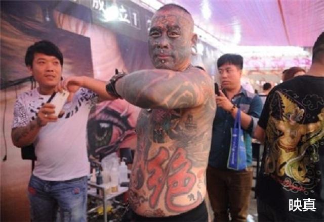 映真|2008年，那个把奥运标志纹在身上的中国纹身第一人，他后悔了吗？