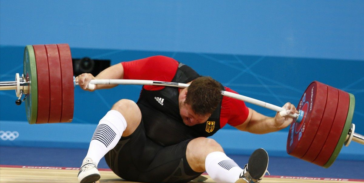 软妈硬爸|奥运会上的感人时刻：带着亡妻照片领奖的奥运冠军