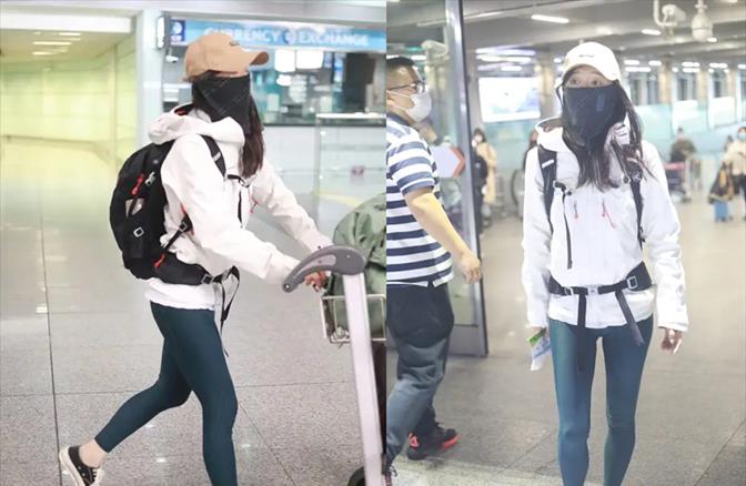 方脸妹说时尚 低调过头！张静初穿防风夹克背书包走机场，手帕当面具造型太高级