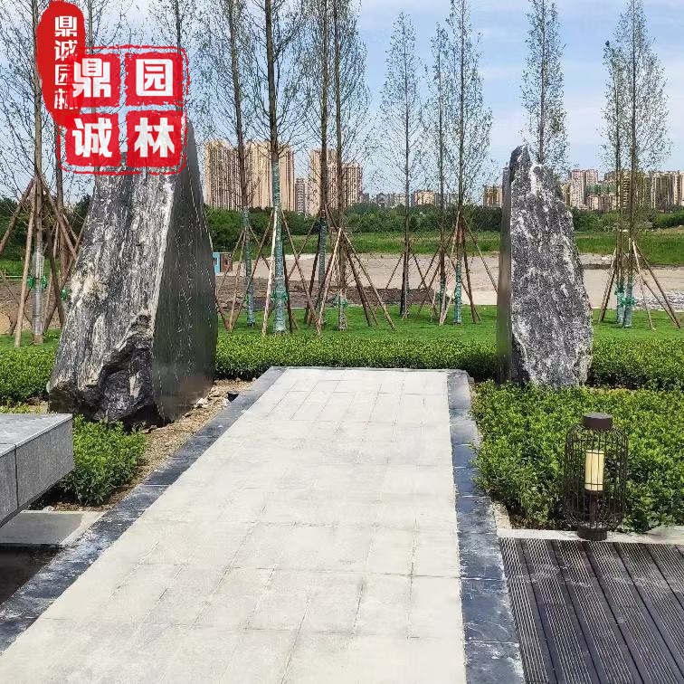 绿城集团|黑山石造景案例图 园林庭院别墅摆景石 天然景观造景黑山石
