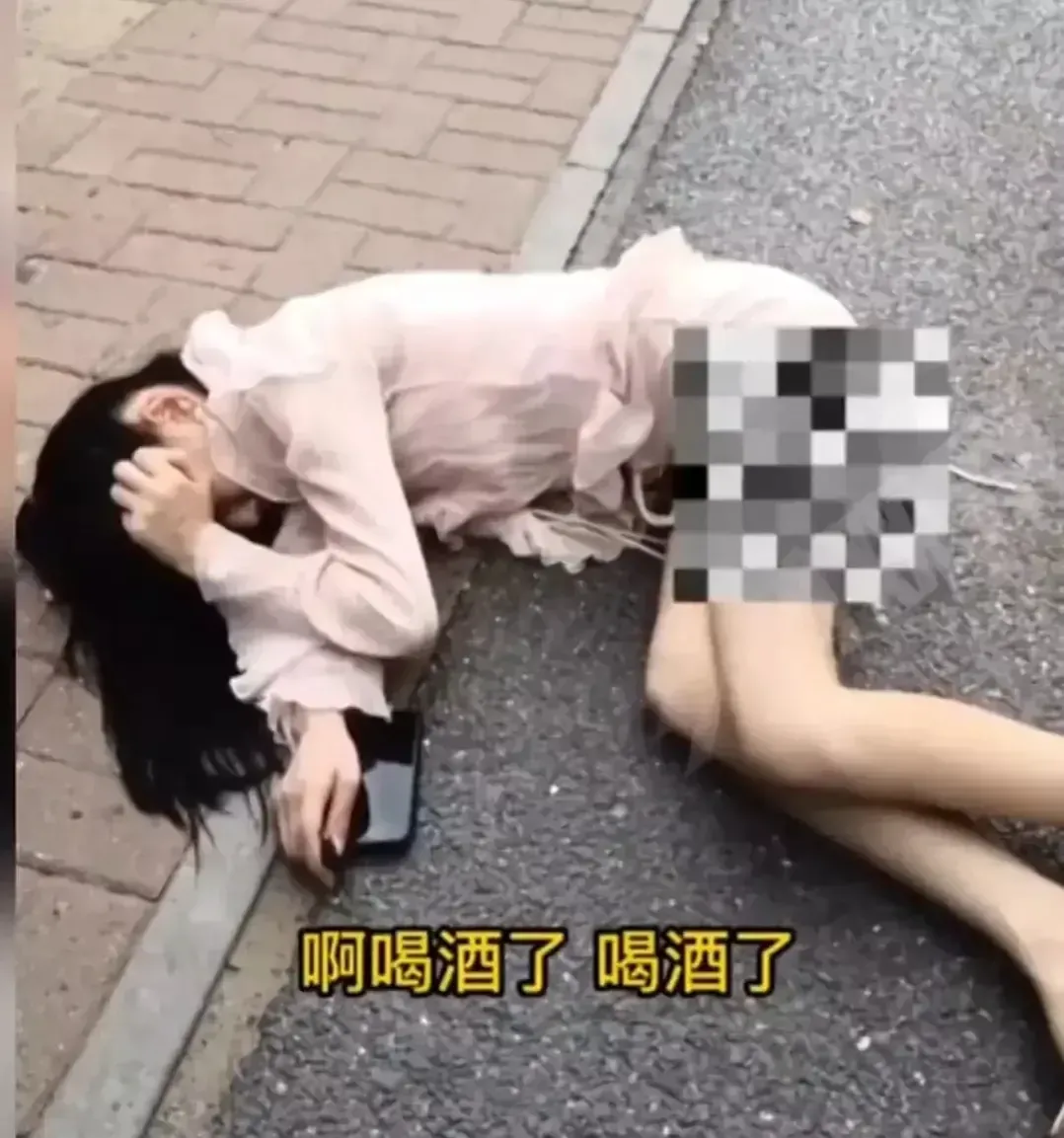 河南郑州,一大早,一名年轻女子躺在了街头,不时传出阵阵低声哭泣的声音