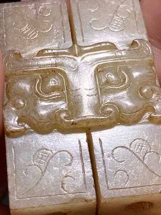 和田玉籽料|明以前 和田玉籽料 白玉受沁 兽面纹 双联 玉勒子 挂件