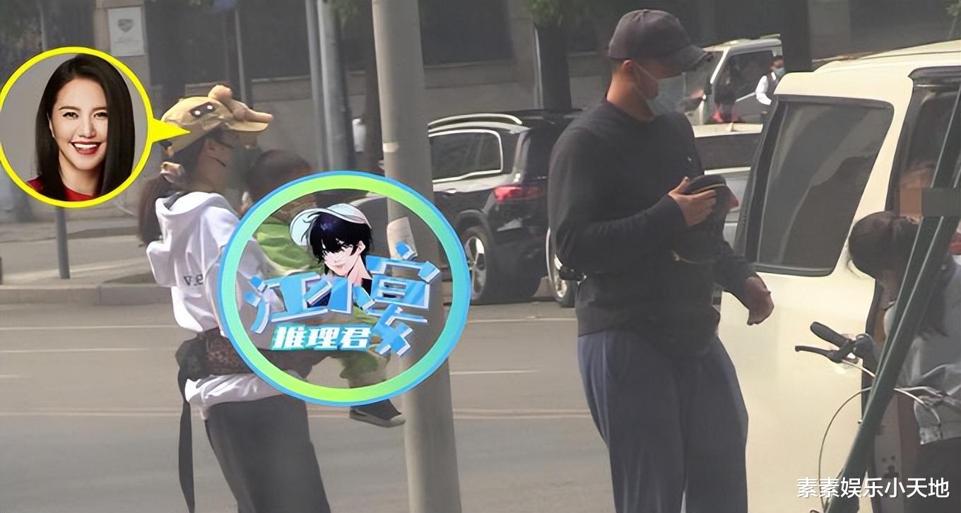 谭维维|谭维维抱两孩子出镜，疑似已经当妈，和老公外出给孩子挑水果
