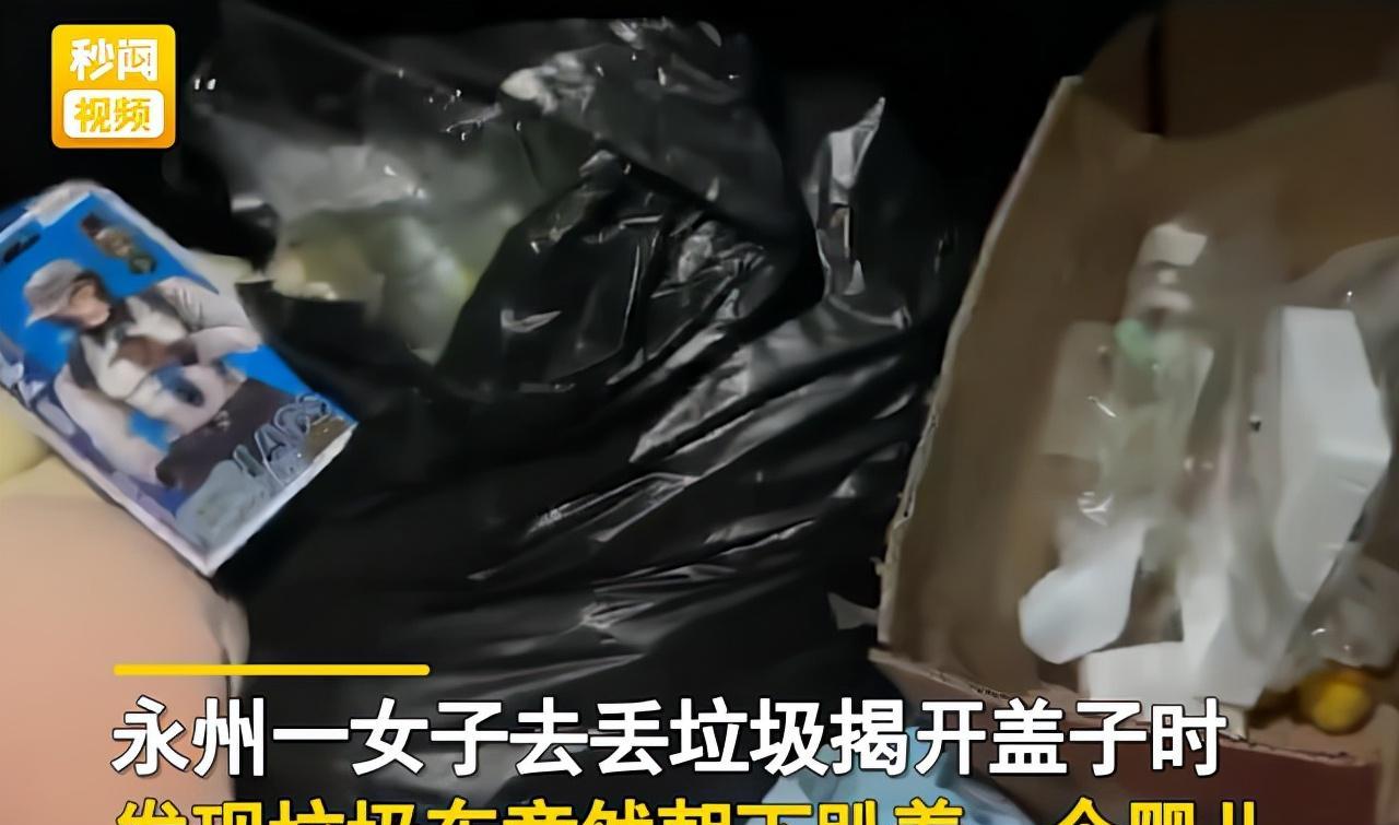 湖南女子朝垃圾车里扔东西,掀开盖子发现婴儿在上面,路人说出目击现场