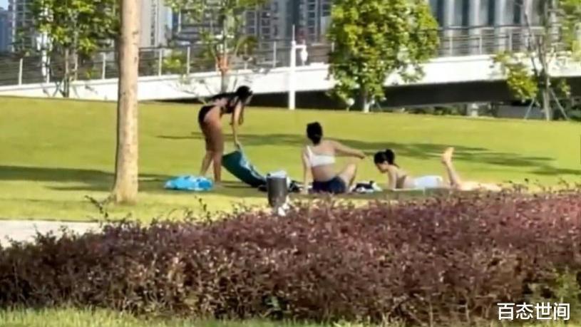 广州三名比基尼美女在广州塔下草坪上晒日光浴，均中暑昏迷住院
