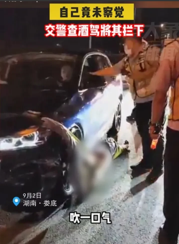 “你是个人吗!还想讲什么!”交警拉着撞人后又将人拖行了一公里多的女子
