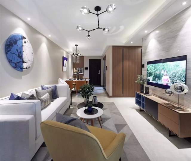 89平现代风三居室,沙发背景墙和餐厅连在一起,简洁而又大方