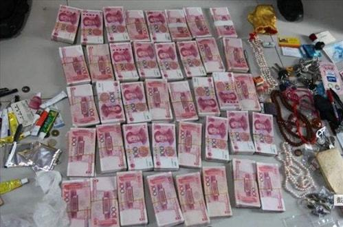 湖南男子买私彩被骗1万后,如法炮制一年诈骗80亿,家中摆满现金
